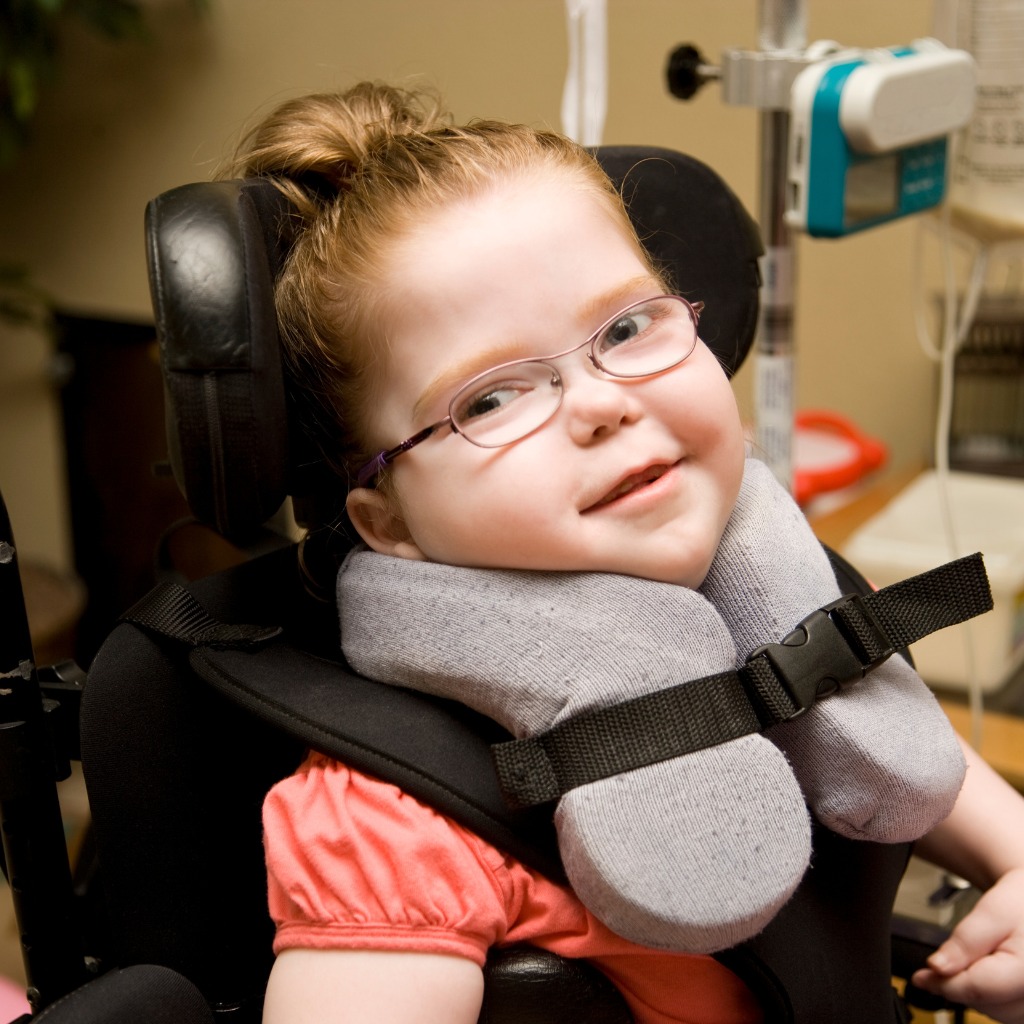 Child with cerebral palsy taking part in a physiotherapy session